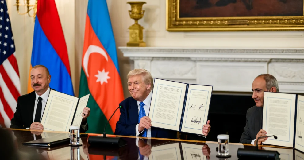 President Donald Trump, Azerbaijani President Ilham Aliyev, and Armenian Prime Minister Nikol Pashinyan hold signed peace agreements at the White House in Washington, D.C., August 8, 2025.