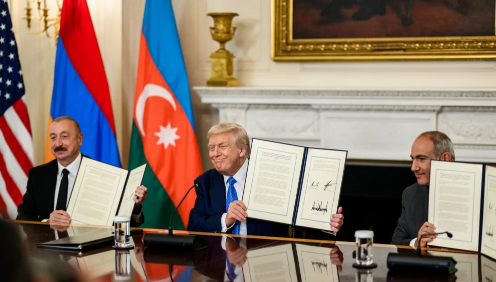 President Donald Trump, Azerbaijani President Ilham Aliyev, and Armenian Prime Minister Nikol Pashinyan hold signed peace agreements at the White House in Washington, D.C., August 8, 2025.